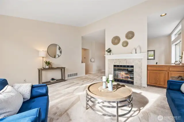 Inviting living room featuring a natural gas fireplace and bright, open ambiance