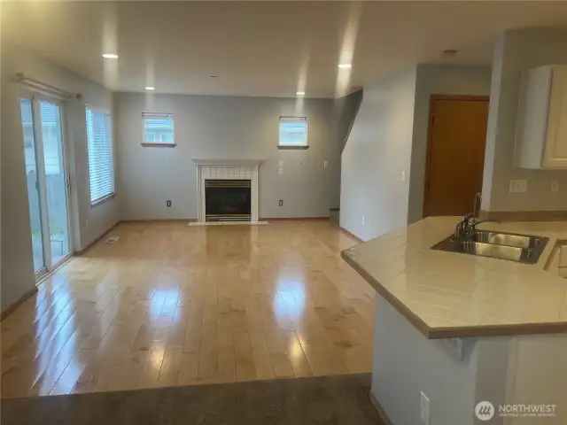 Family room with gas fireplace and hardwood floors