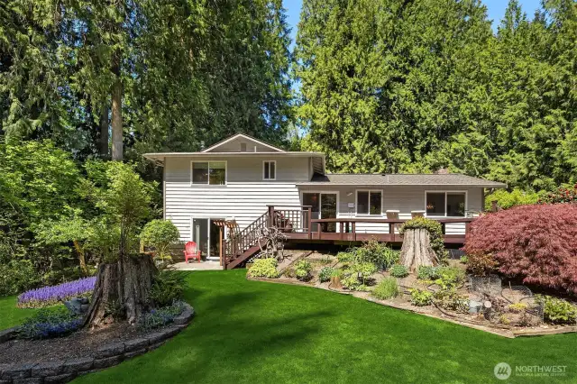 Colorful gardens surround this lovingly maintained home and property.