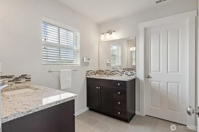 Primary ensuite w/ double vanities