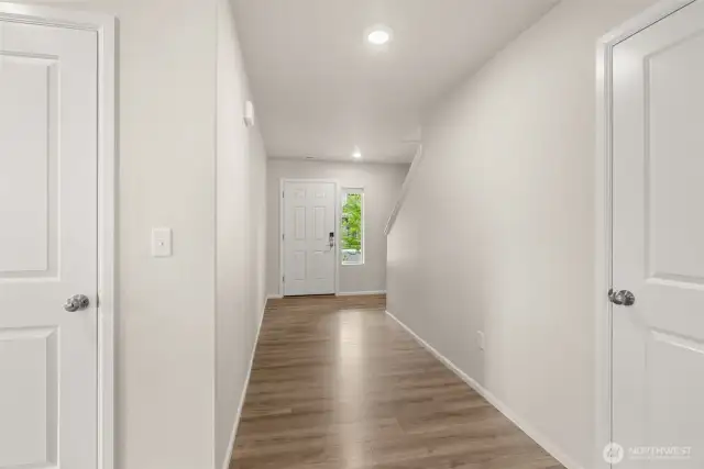 Entry way leading you to the main floor bedroom, bathroom, kitchen, and living room.