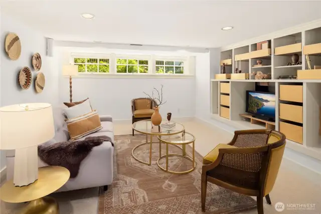 Imagine curling up on the sofa with a big bowl of popcorn, the lights low, and your favorite movie playing in this lower-level daylight hideaway.