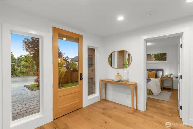 Entry-level elegance with natural light pouring in from oversized windows.