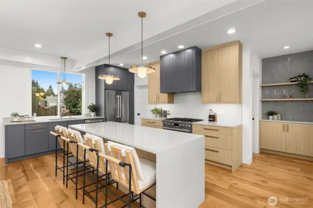 Kitchen goals unlocked with quartz counters and a waterfall island.