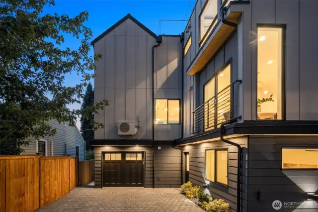 Crisp angles and wood accents create a memorable backyard presence.