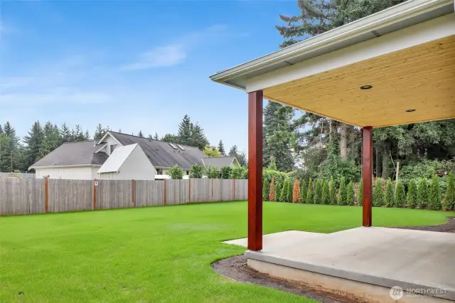 Look at this backyard! South-facing and sun-soaked, it features in-ground irrigation, partial fencing, and a covered patio—perfect for summer BBQs and evening hangouts.
