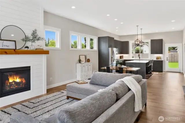 The moment you walk through the front door, you’ll feel the warmth and welcome of this beautifully crafted home. Quality craftsmanship shines throughout, from the gas fireplace with shiplap surround to the open and inviting Great Room—perfect for relaxing or entertaining.