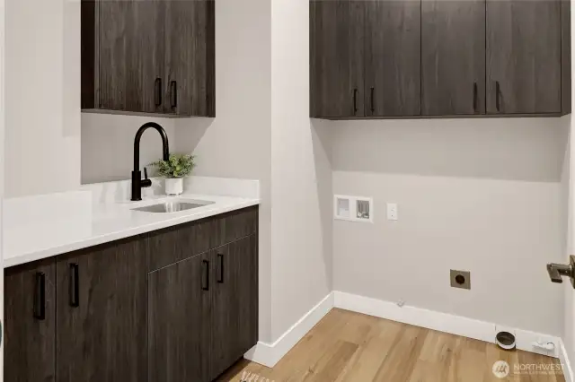 Even the laundry room was thoughtfully designed—with plenty of storage, a built-in folding table, and a handy sink to keep things running smoothly.