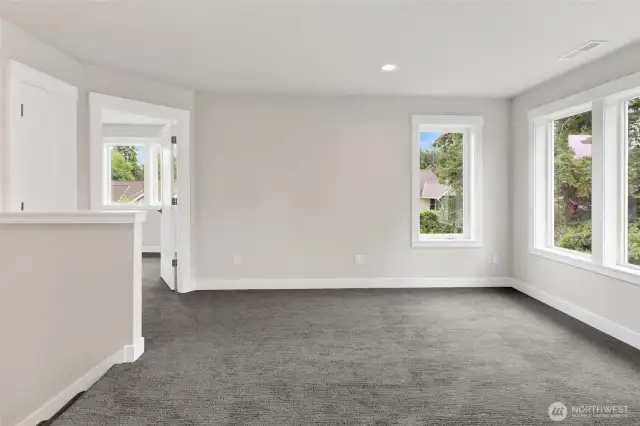 Upstairs, you’ll find a versatile flex space—perfect for a cozy TV lounge, playroom, exercise area, or whatever fits your lifestyle best.