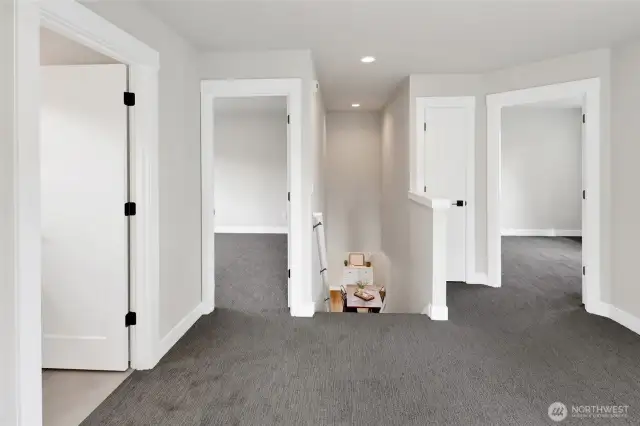 The flex space is centrally located between the other bedrooms and bathroom.