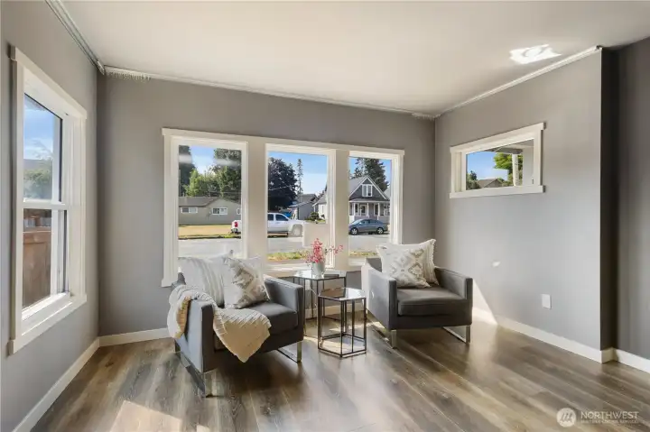 Seating area with abundant windows, keeping the home light & bright