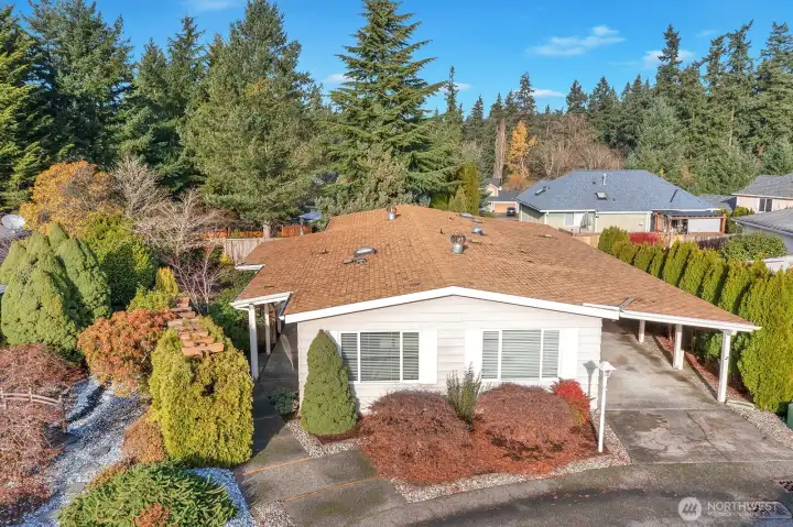 Street view of this well cared for, level entry, updated home in Heather Hills a gated, 55 + community. This home has modern features with a bit of Pazazz!