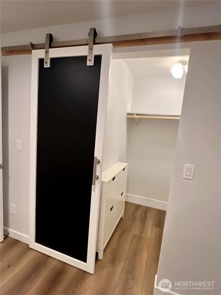 Walk-in closet in primary bedroom