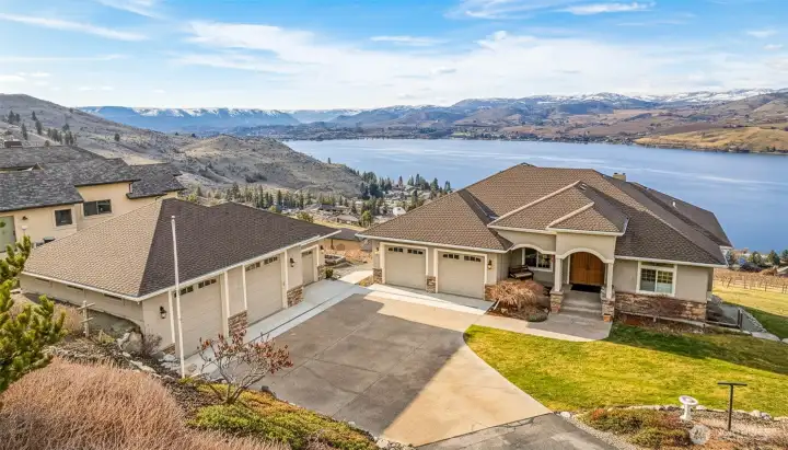 Welcome to 144 Mirabella Dr offering panoramic Lake Chelan views in the Clos CheValle gated community. Daylight rambler with 5 beds/4 baths, 2 kitchens, in-ground pool, attached 2 car garage and detached 1128 sq ft garage with shop & half bath.