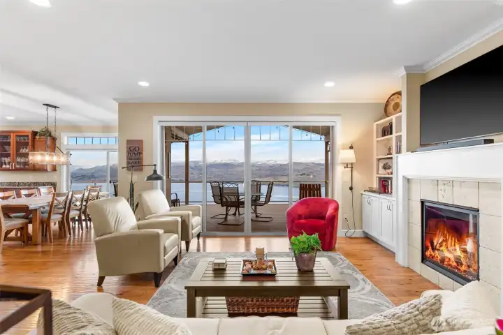 The first impression is the window/slider wall in the entire great room which focuses on the spectacular panoramic Lake Chelan and mountain views.