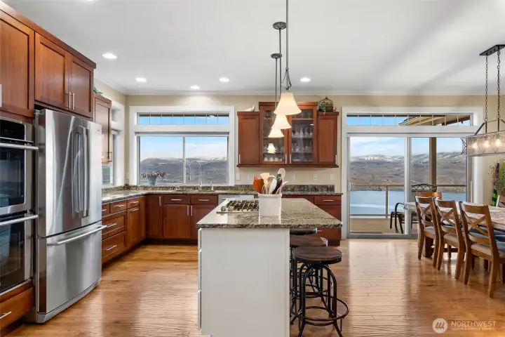 This kitchen has a wonderful layout. There is plenty  of space for chef's helpers, and the cook is connected to the entire great room and deck.