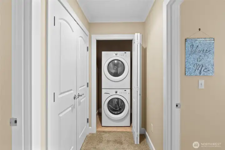 No need to haul laundry up the stairs, the lower level has its own full-sized stackable washer & dryer, included in the sale.