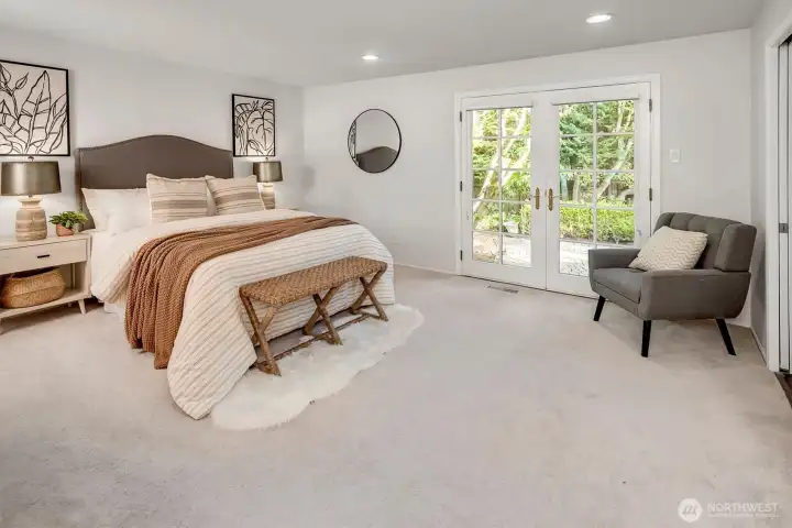 The generous-sized primary suite spotlights an updated bathroom, walk-in closet & second closet.