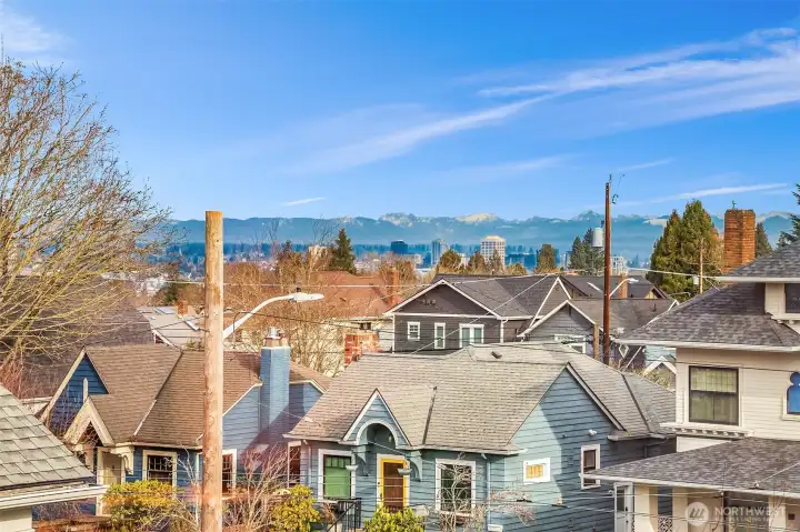 Cascade mountain views from the primary bedroom window.