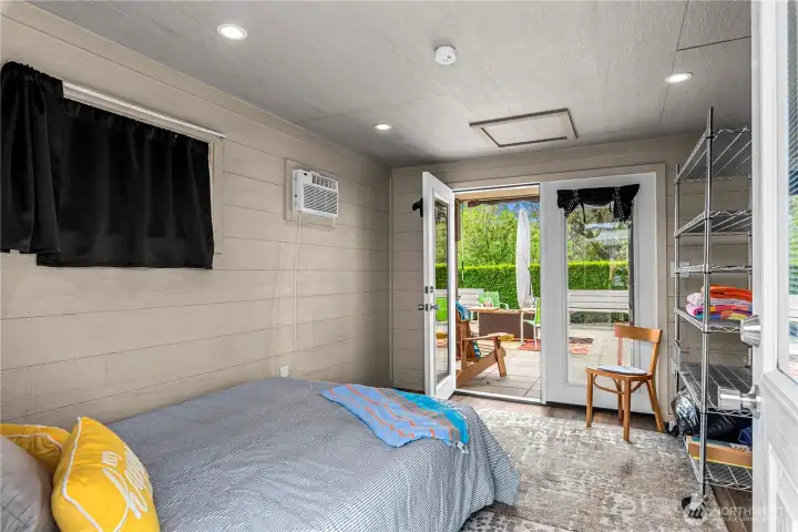 Nicely situated just off the patio. Those full-glass doors have between-the-glass blinds.