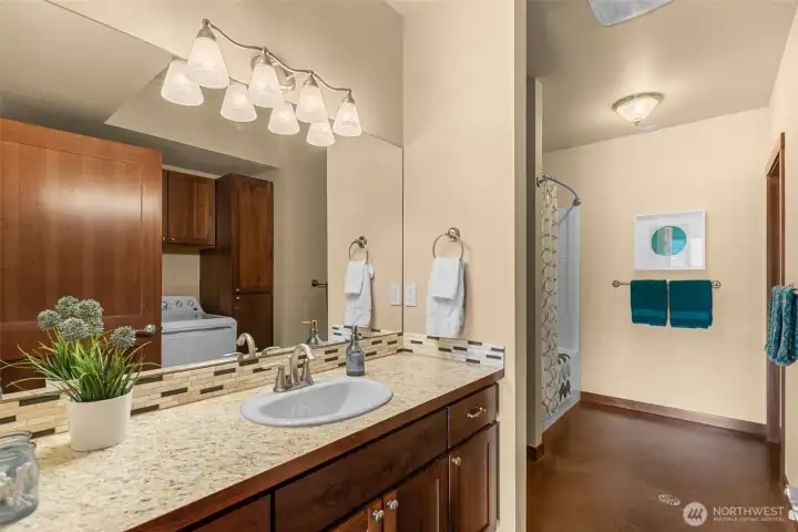 Lower bathroom that includes a washer/dryer