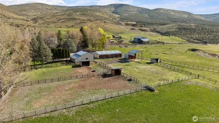 Birdseye view of the fenced areas behind the barn