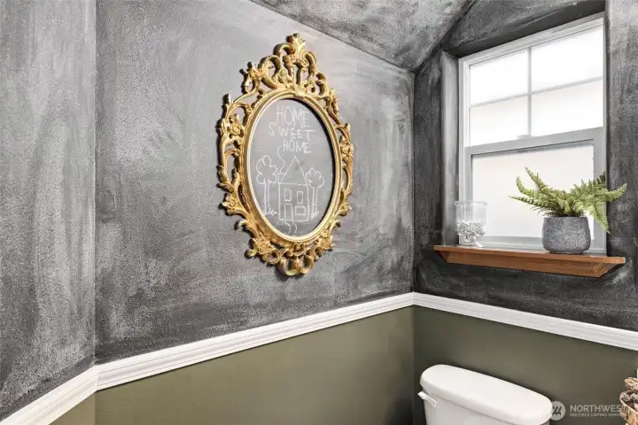 This charming powder bath features a chalkboard paint, and these owners had guests draw messages or leave notes. A living guest book! Home Sweet Home :)