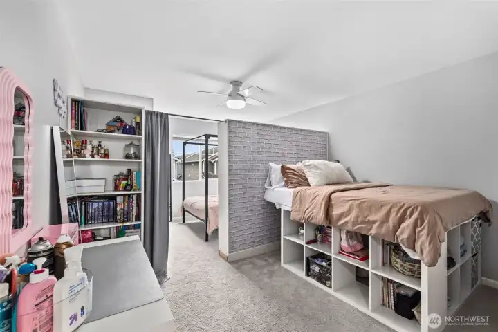 Custom shelving in the oversized 3rd bedroom. This room acts as 2 spaces, where you can have dual beds (current use), or an office space, or expansive dressing area.