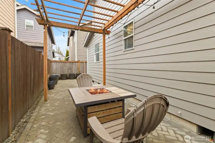 Custom hard-scaping for a low maintenance and fully fenced yard! Enjoy firepit conversation, and there's room for a hot tub!