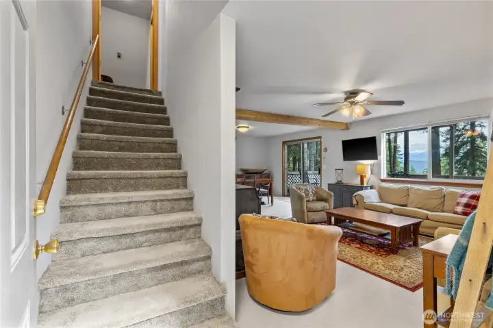 Entry leads to stairs and living space soak up the views as you walk in the door.
