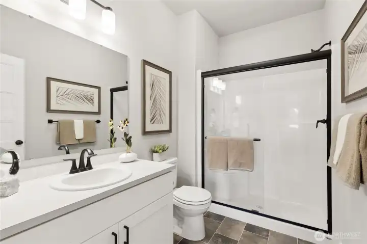 Jr suite bathroom - Photos are of Sterling model home. Colors and features will vary.