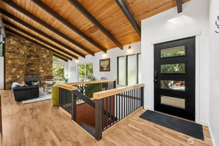 Beautiful, Open entryway with staris down to garage.