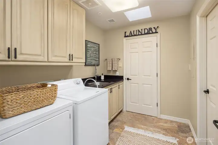 Utility room with additional room for storage.