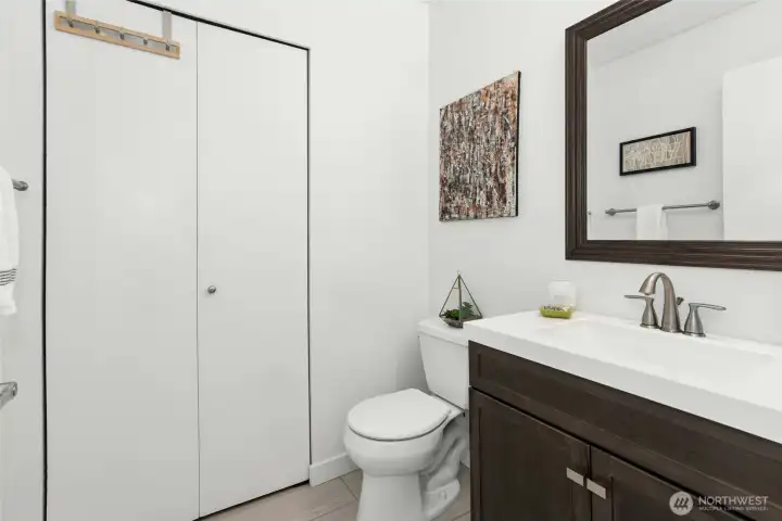 Powder bath on main, laundry behind the bi-fold door!