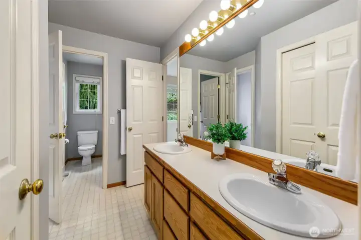 Perfect design Jack and Jill bath with separated double sink vanity opens to guest bedrooms 3 and 4 PLUS hallway too!  Linen closet as well!