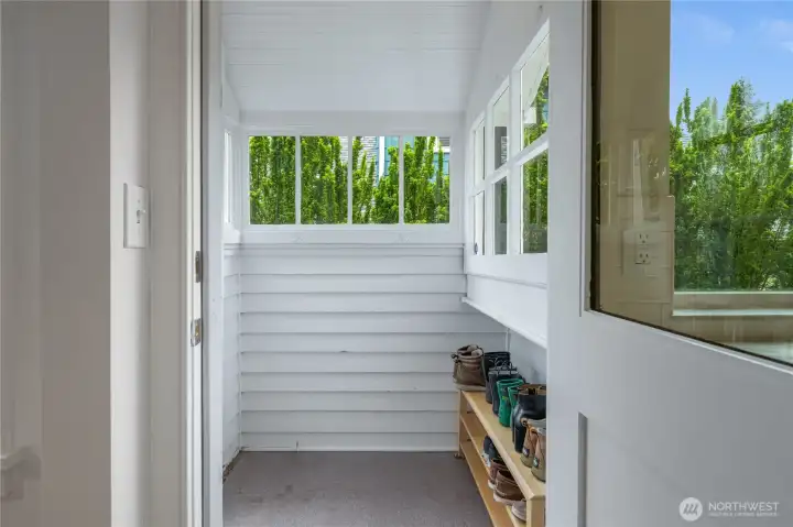 mud room off of kitchen provides access to the side and back yard