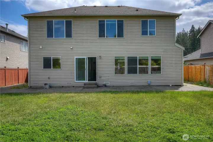 Large fully fenced backyard with plenty of usable space for entertaining, pets, and play.