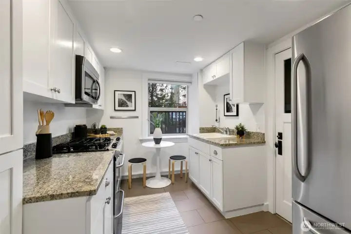 Functional kitchen with easy access to the community patio.