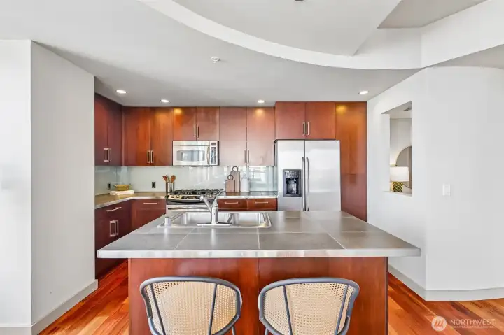 Stainless Steel Appliances and Countertop Seating in the Kitchen Stainless Steel Appliances and Countertop Seating in the Kitchen
