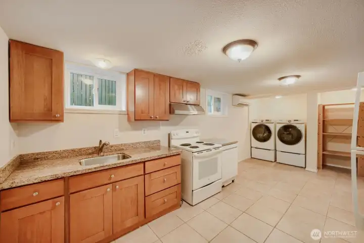 Kitchen and laundry on lower level Kitchen and laundry on lower level