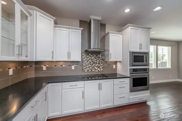 Glass Front lighted cabinetry - notice the pot filler?