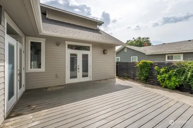 Deck leads into the kitchen/living space and Primary bedroom