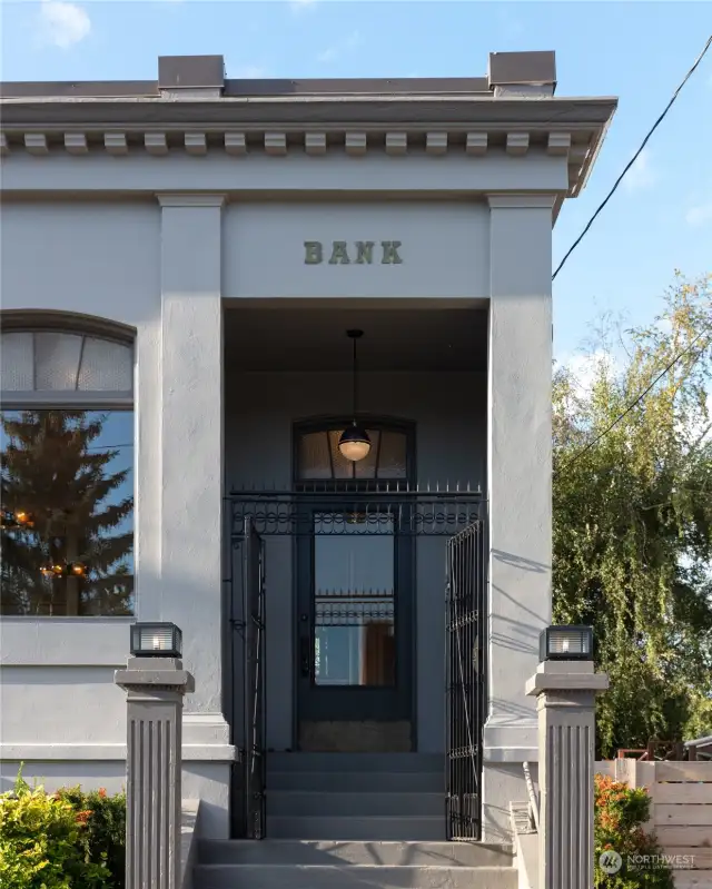 Entrance to the building with black iron gate