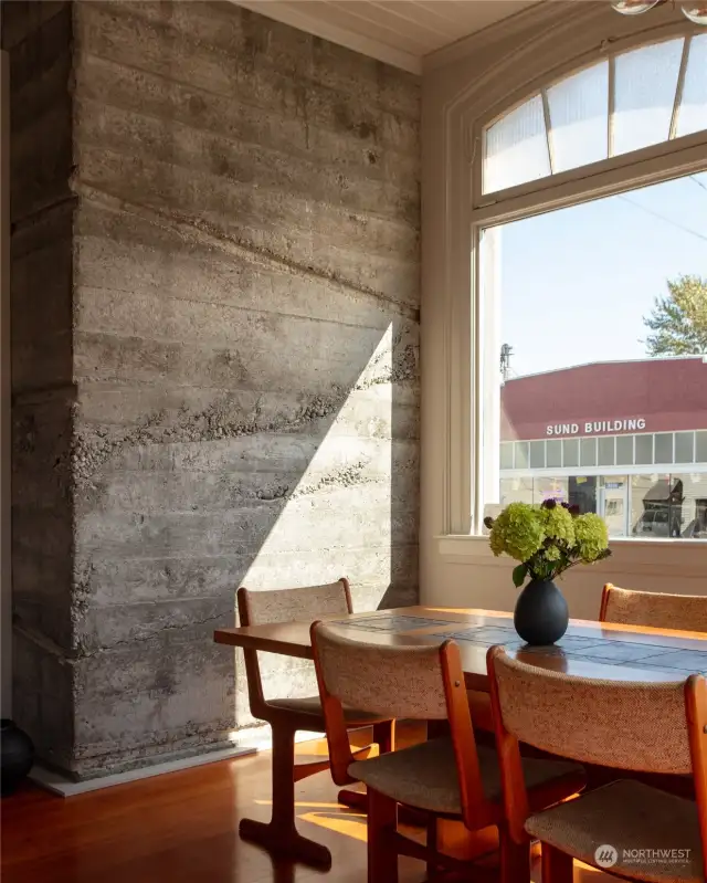 A glance back at the wall between the front entrance and conference table