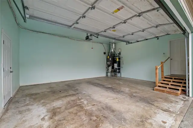 The fully finished garage, the door on the left goes to the fully fenced front yard.