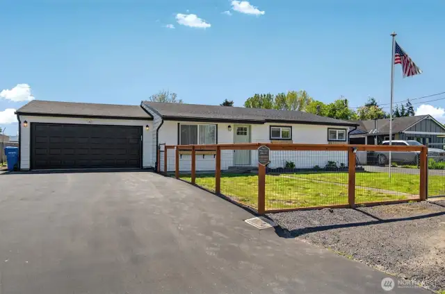 Beautiful completely remodeled home with new attached garage, new roof and siding and fully fenced yard