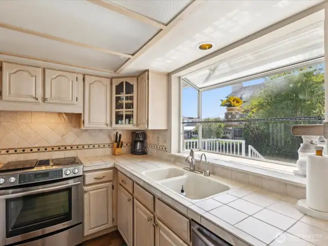 Beautiful kitchen looking out to deck.