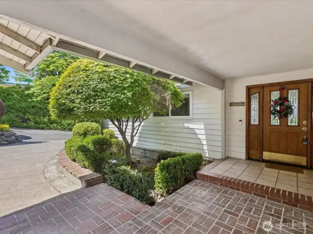 Charming curb appeal with covered breezeway and elegant entrance.