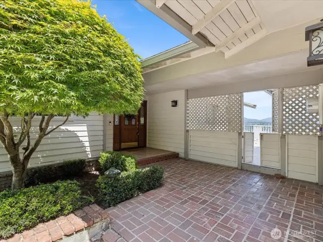 Wonderful curb appeal.  Covered breezeway from huge garage to home.