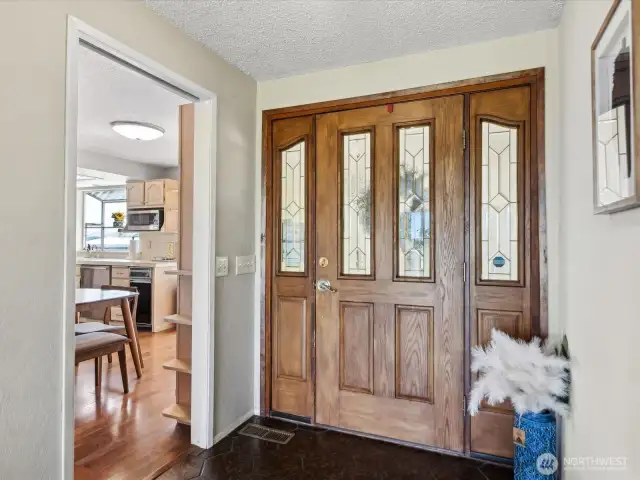 Entryway looking into dining / kitchen (main floor).